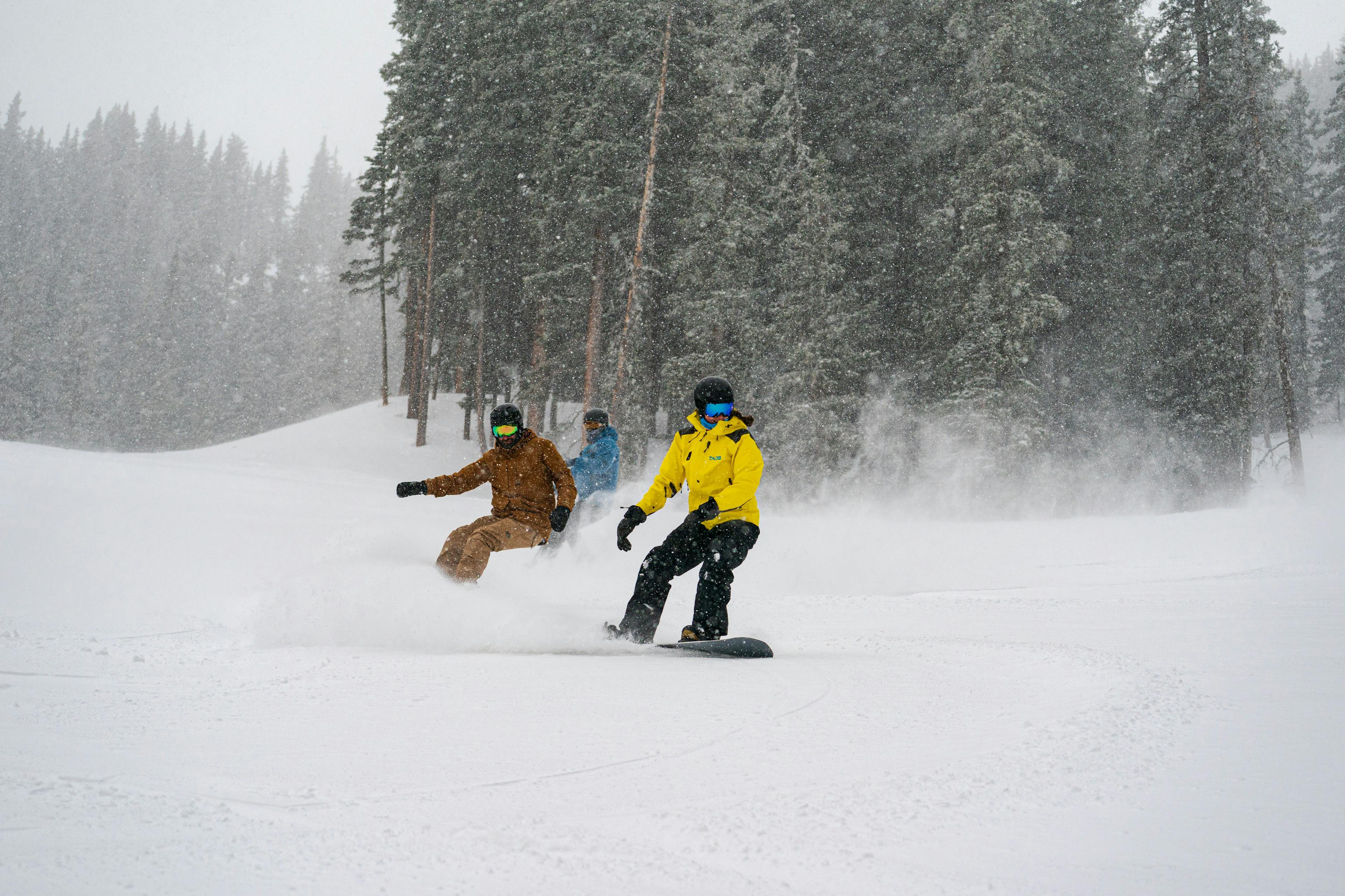Snowboarders taking a lesson at Taos Ski Valley.