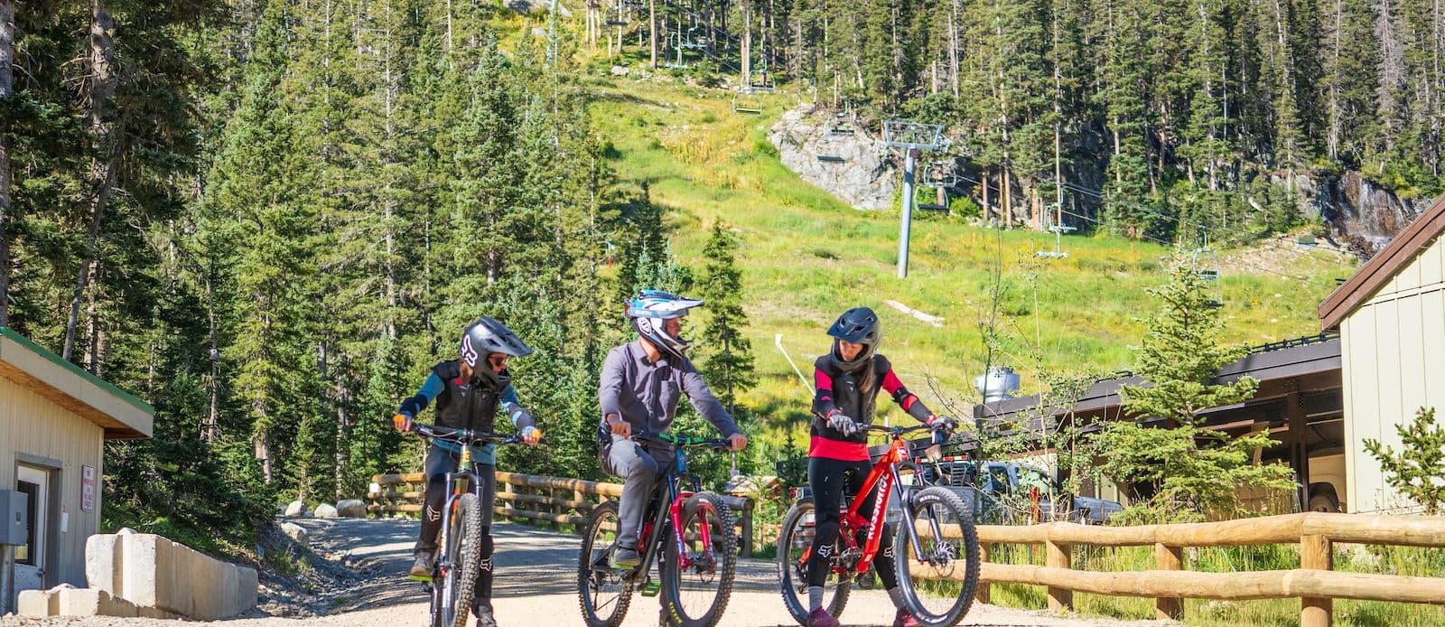 Three people biking at Taos Ski Valley.