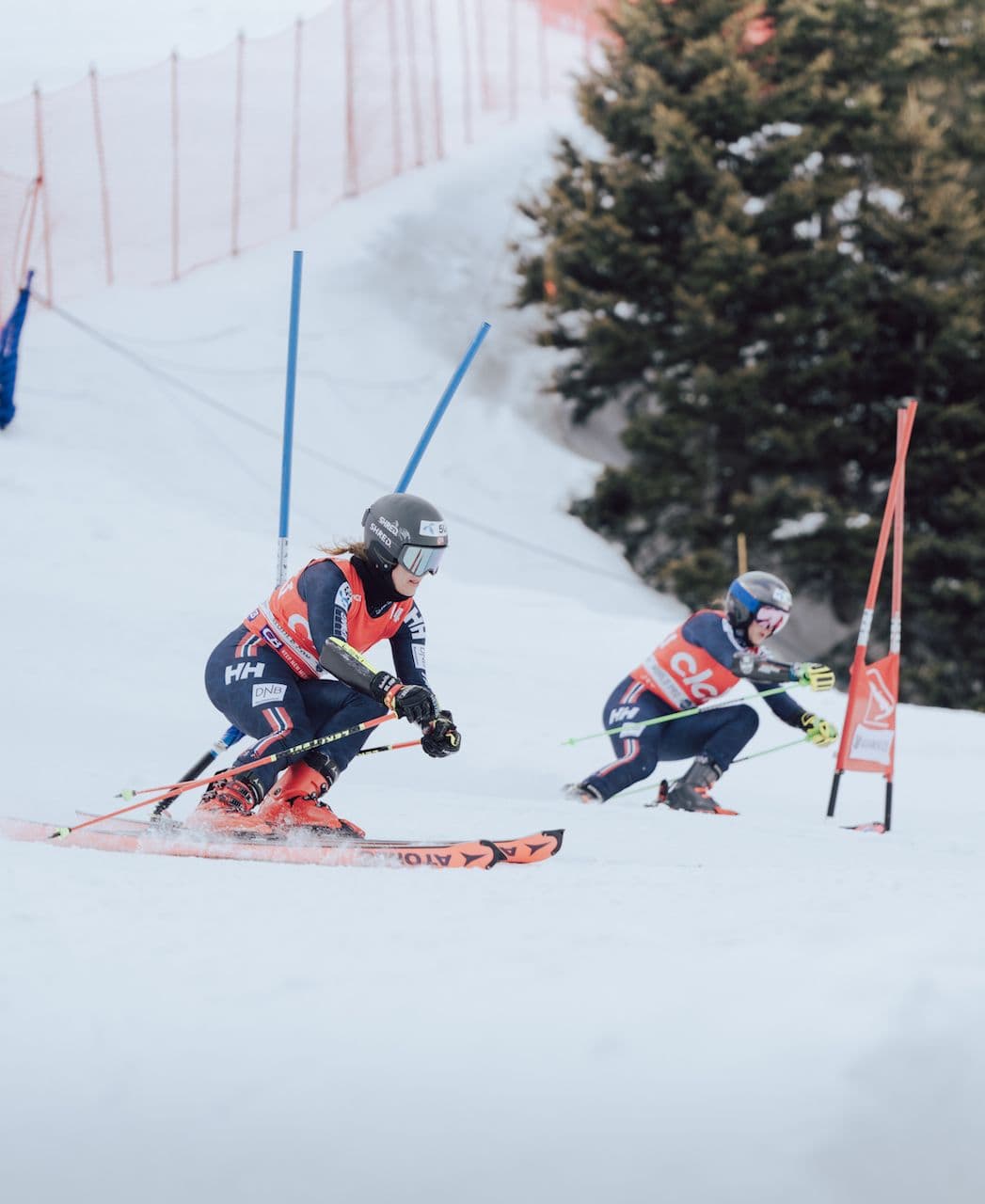 Two ski racers competing at the World Pro Ski Tour in Taos Ski Valley