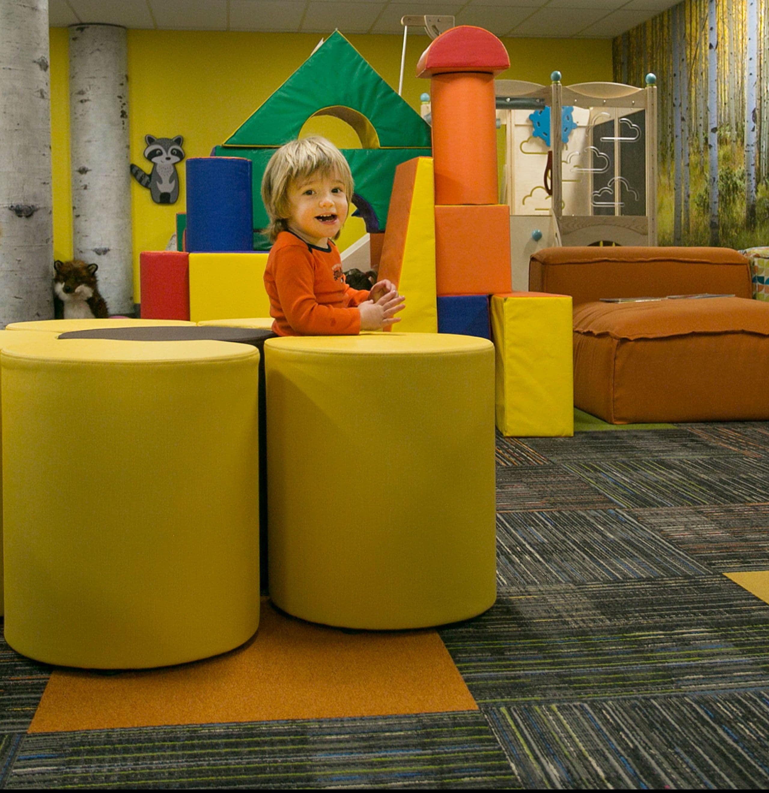 Child enjoying childcare playroom at Taos Ski Valley