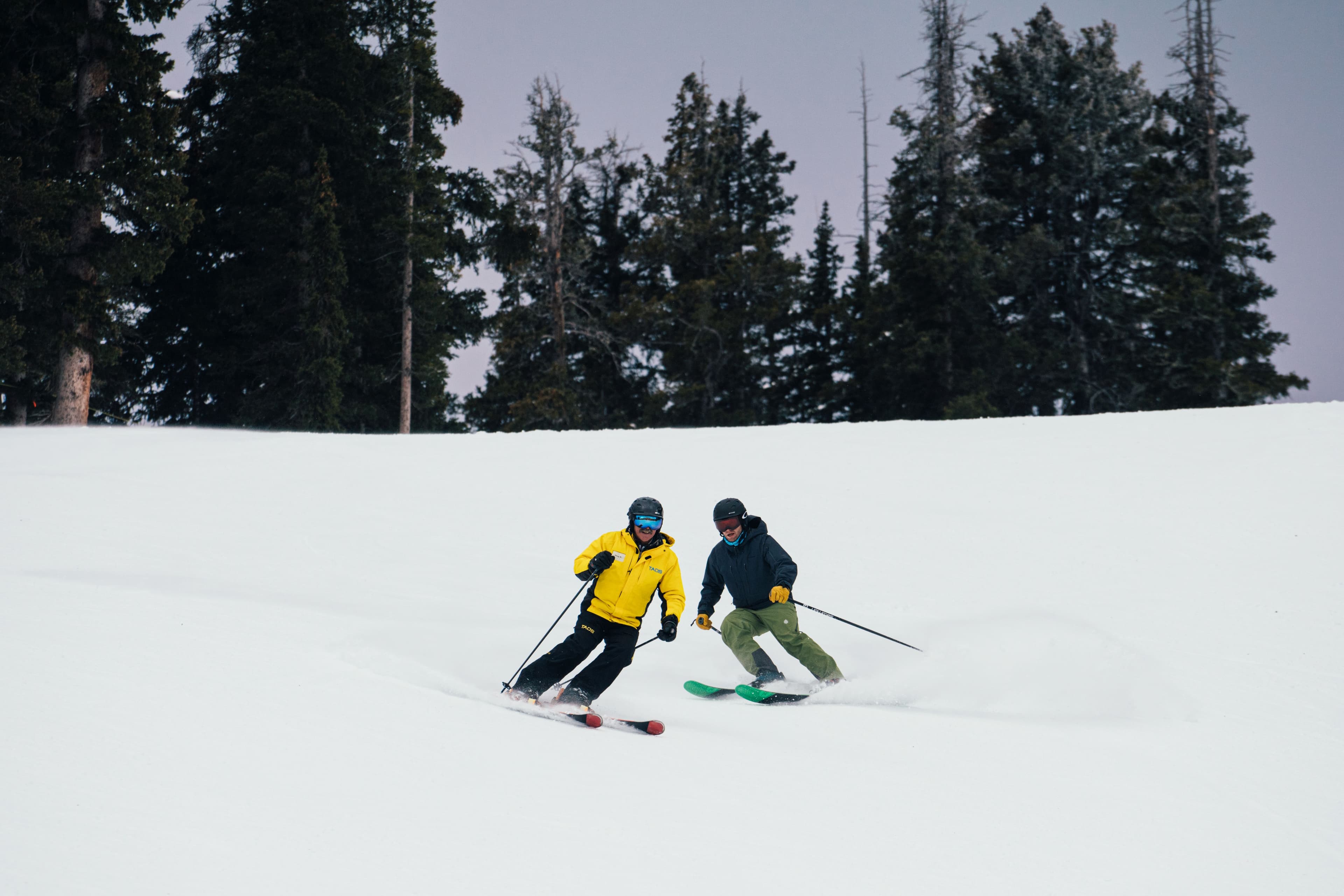 Snowsports instructor demonstrates proper turns during a private lesson