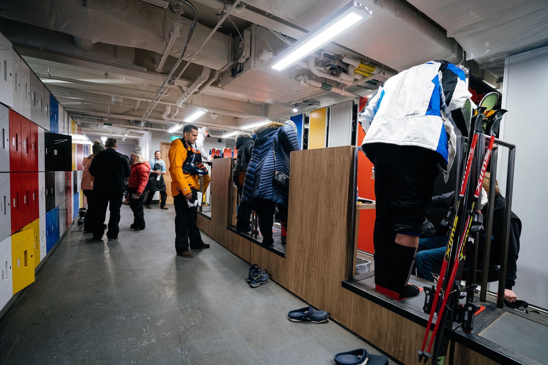 People getting fitted for ski and snowboard boots at Taos Sports.