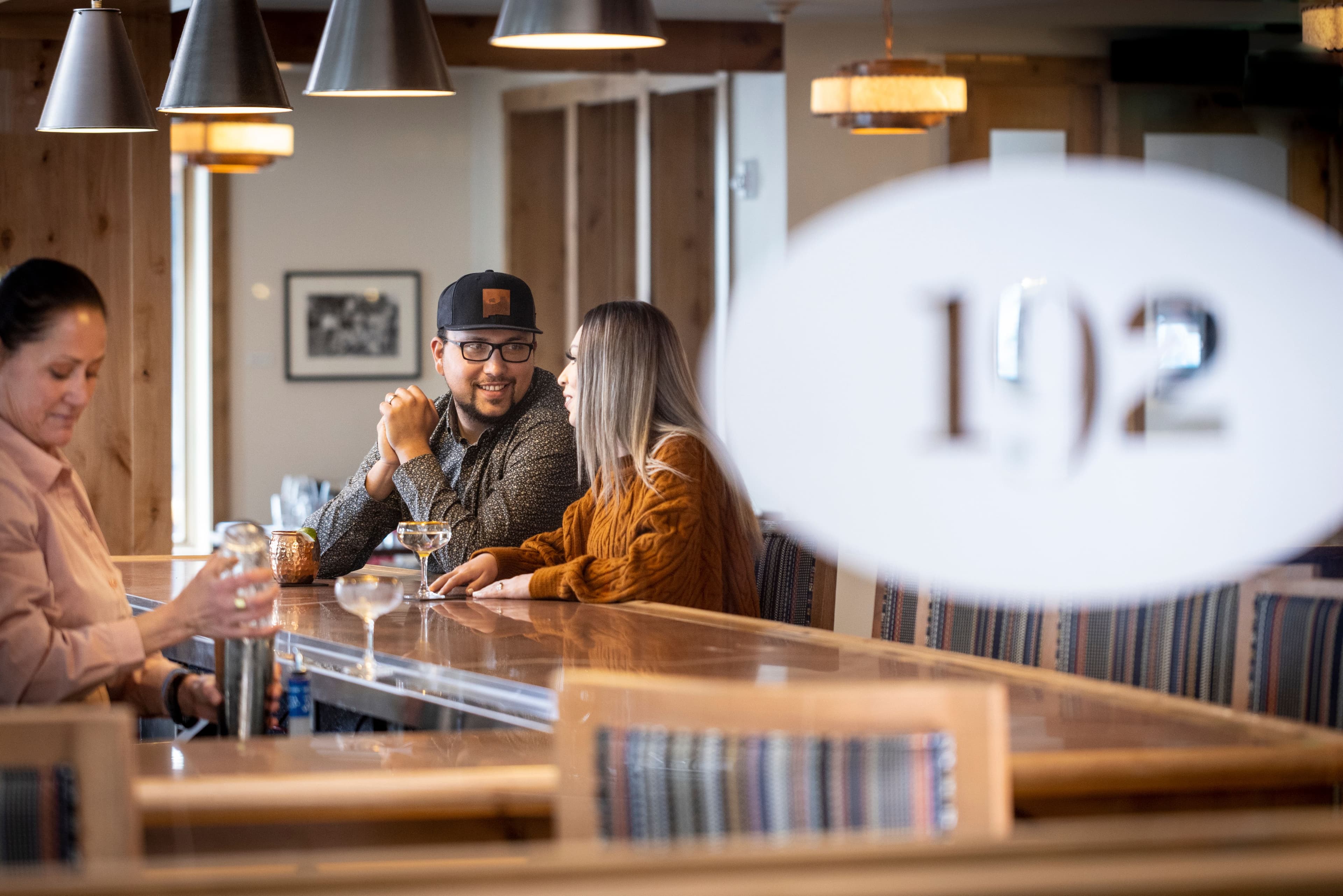 A couple enjoying the bar at 192. 