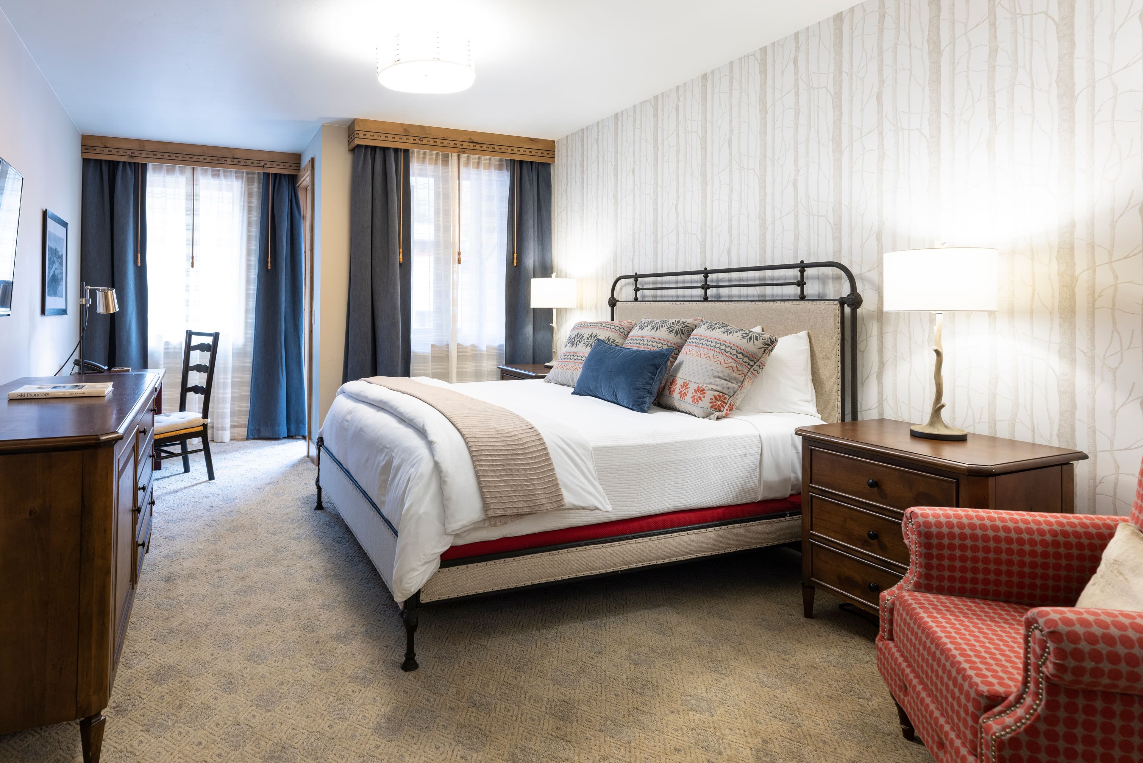 A queen bed hotel room at The Blake Resort at Taos Ski Valley.