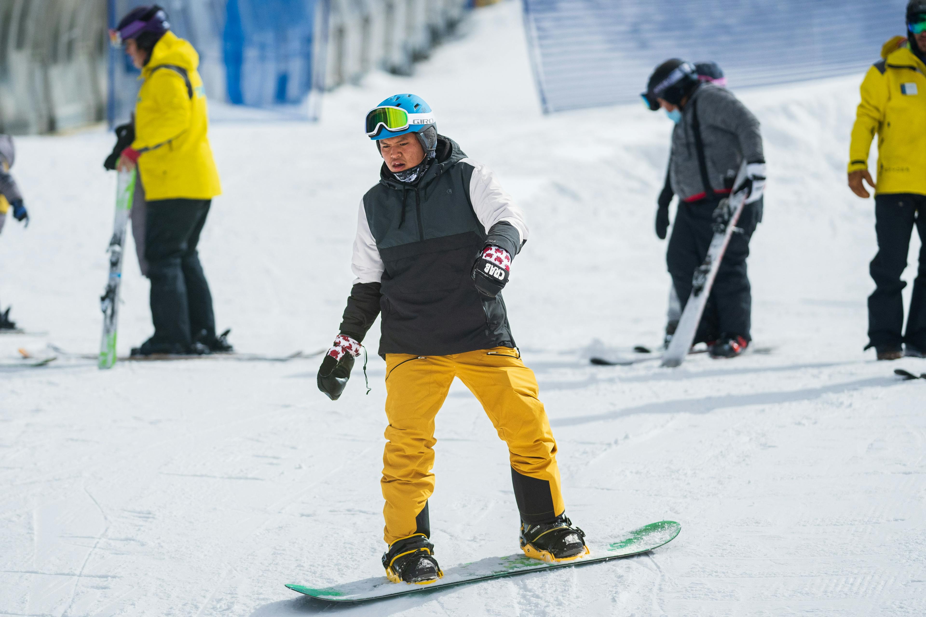 Snowboarder in a snow sports lesson at Taos Ski Valley