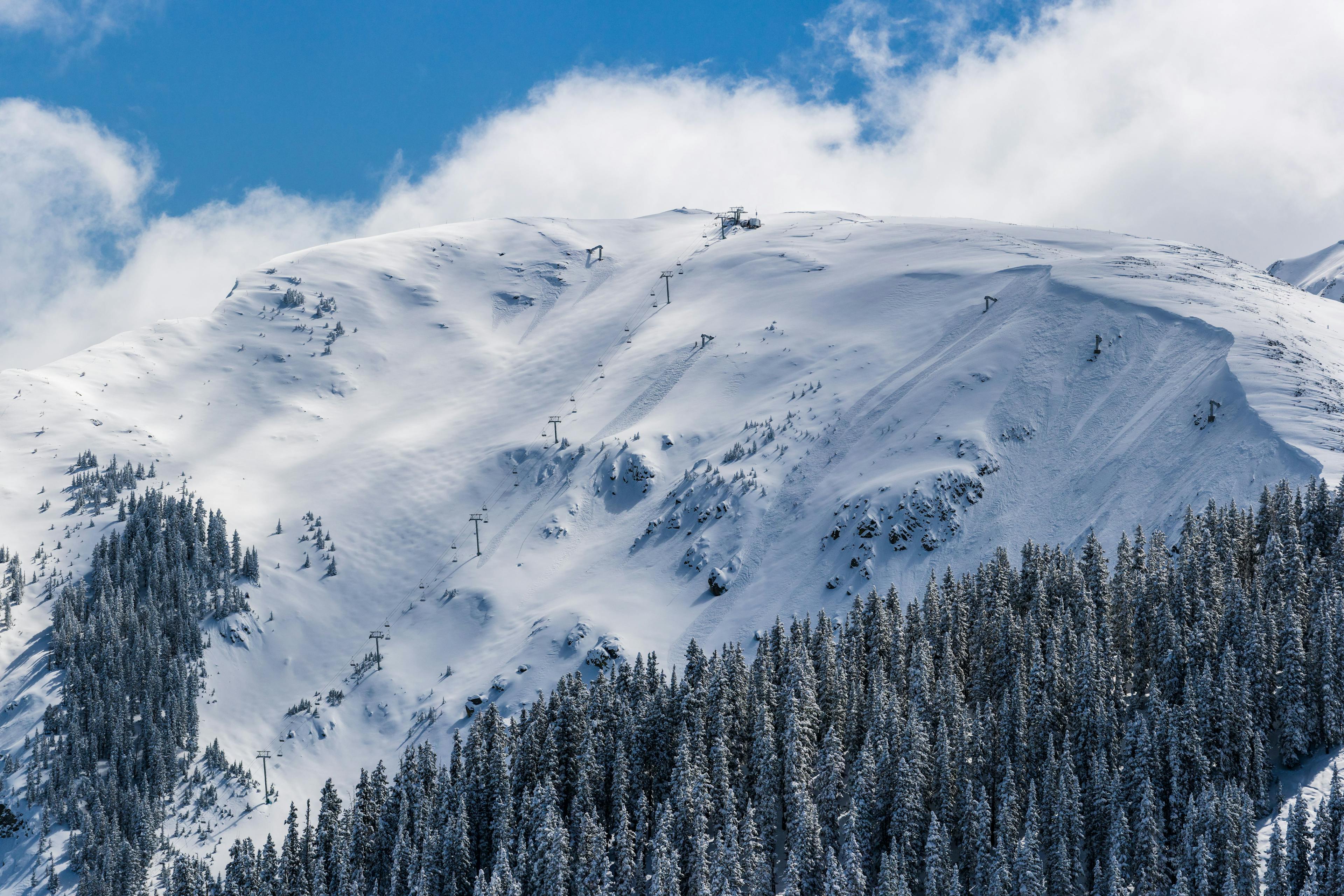 A distant photograph of kachina peak covered in snow