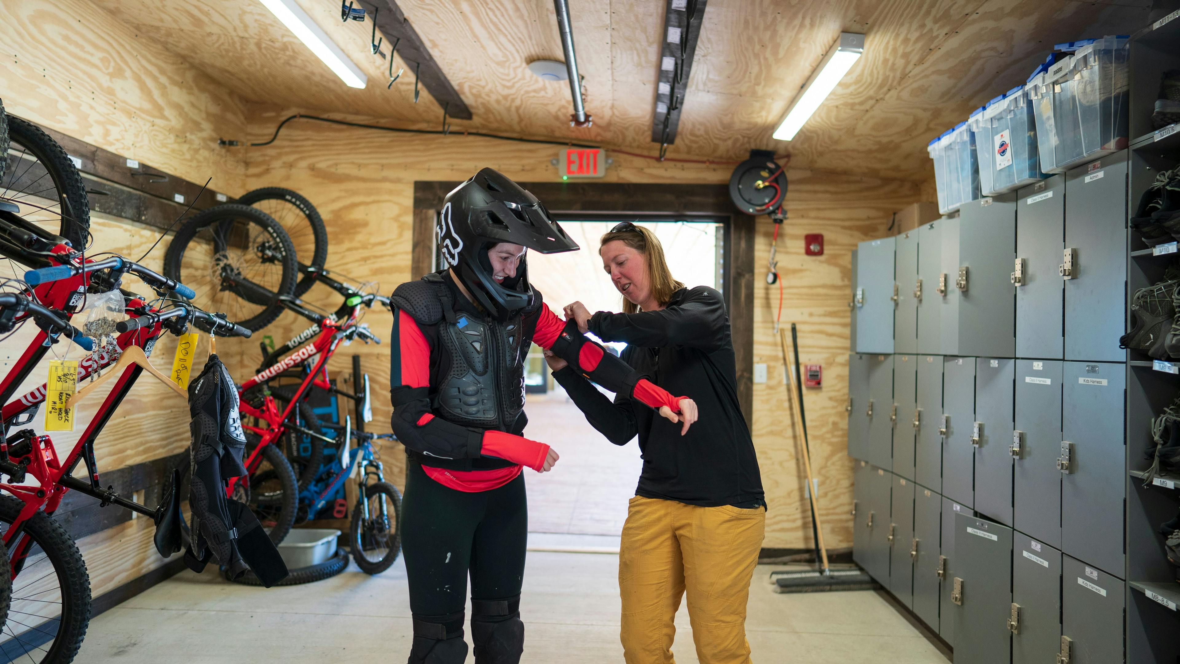 Mountain biker gets suited up with padding at TAOS Ski Valley