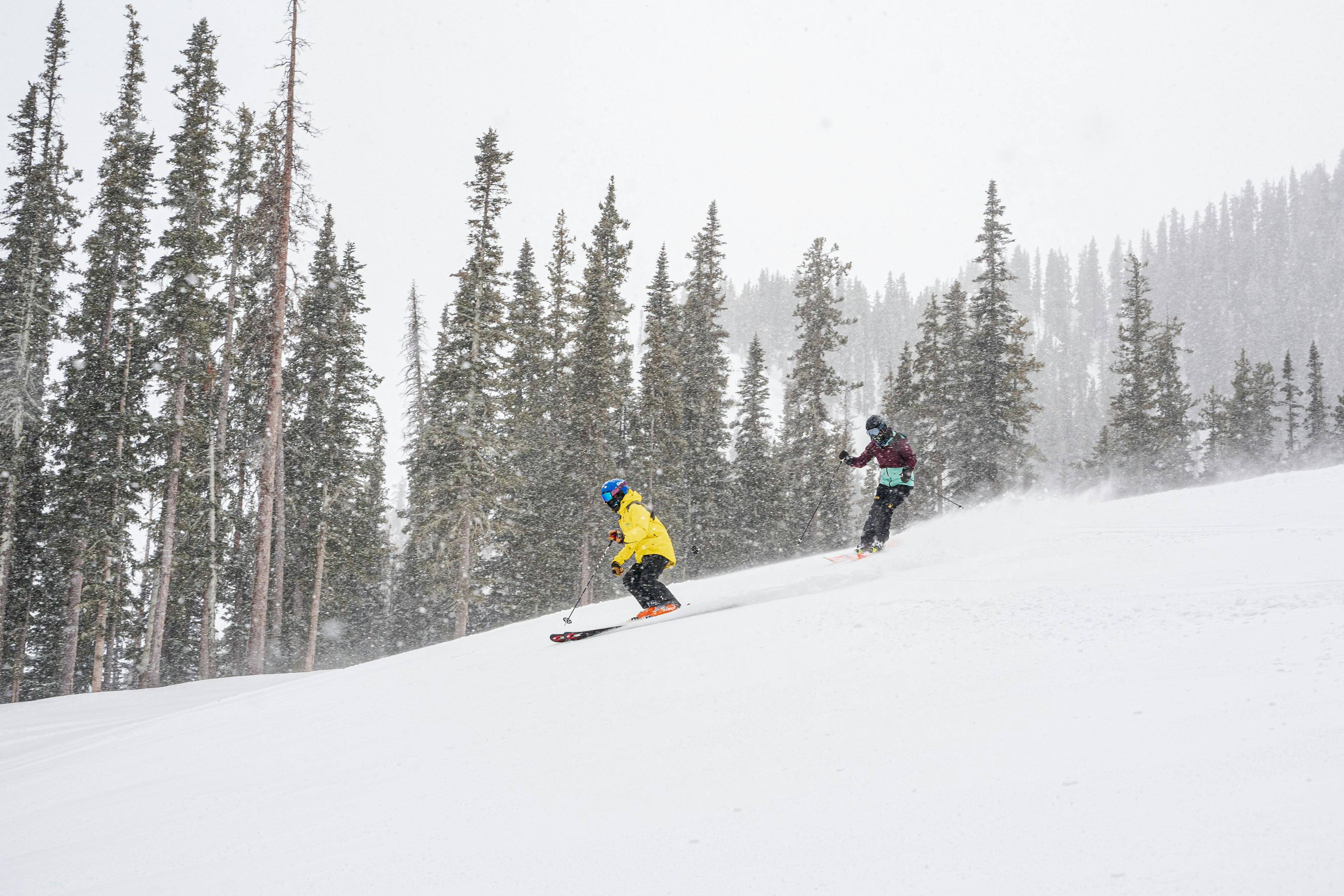 A skier and instructor heading down a run at Taos Ski valley.