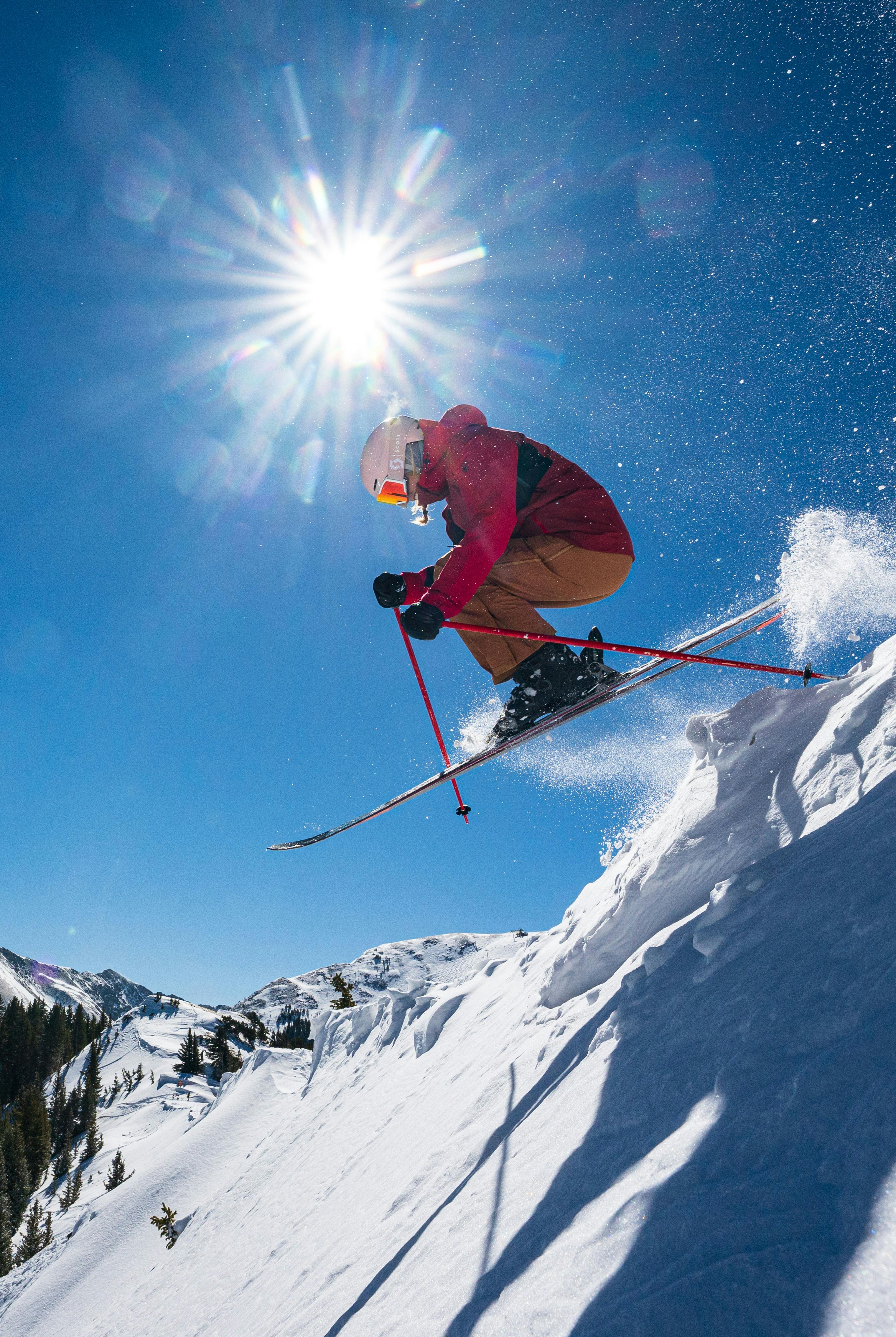 Skier catches air on a steep run at Taos Ski Valley