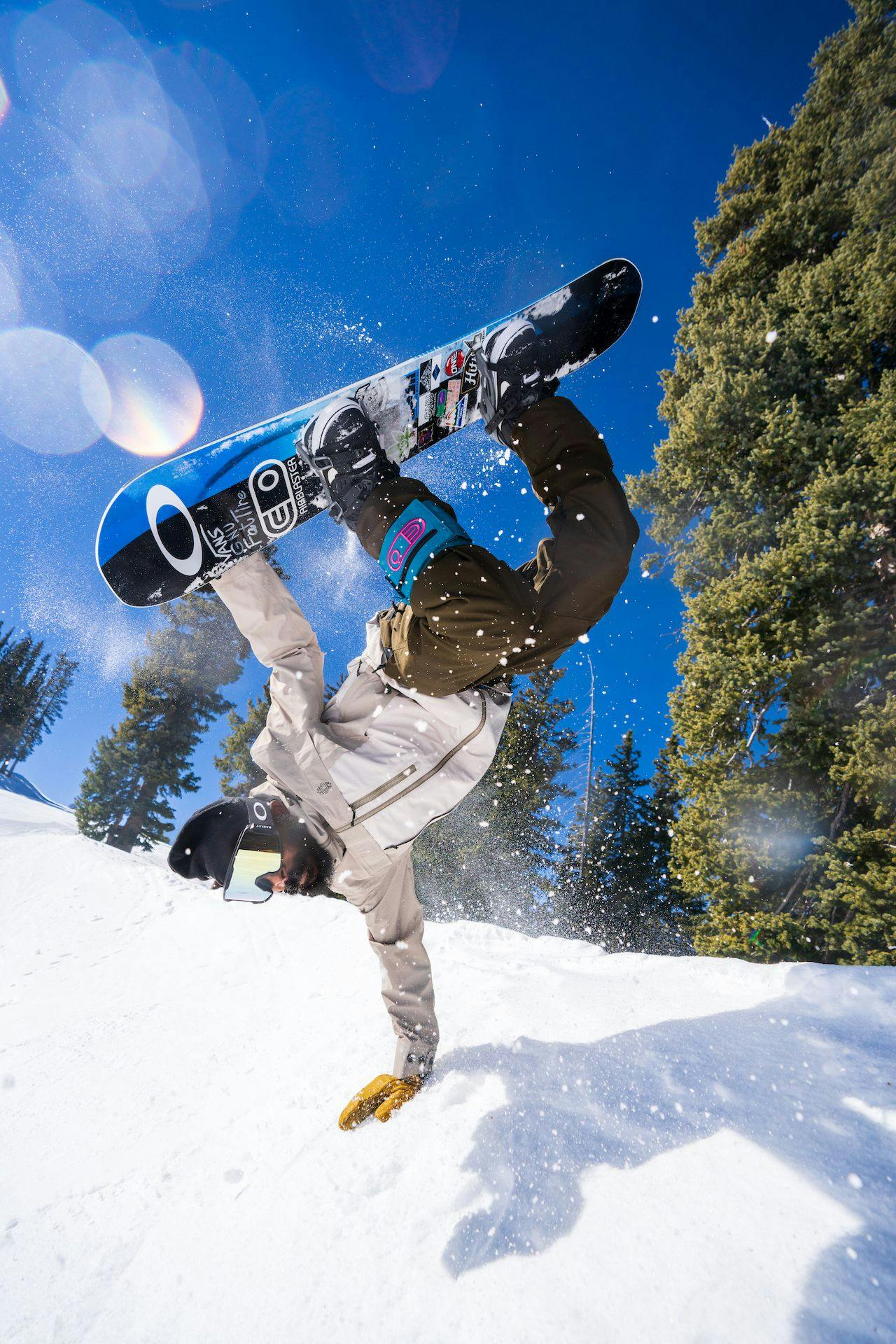 Snowboarder does a handstand trick at Taos Ski Valley 