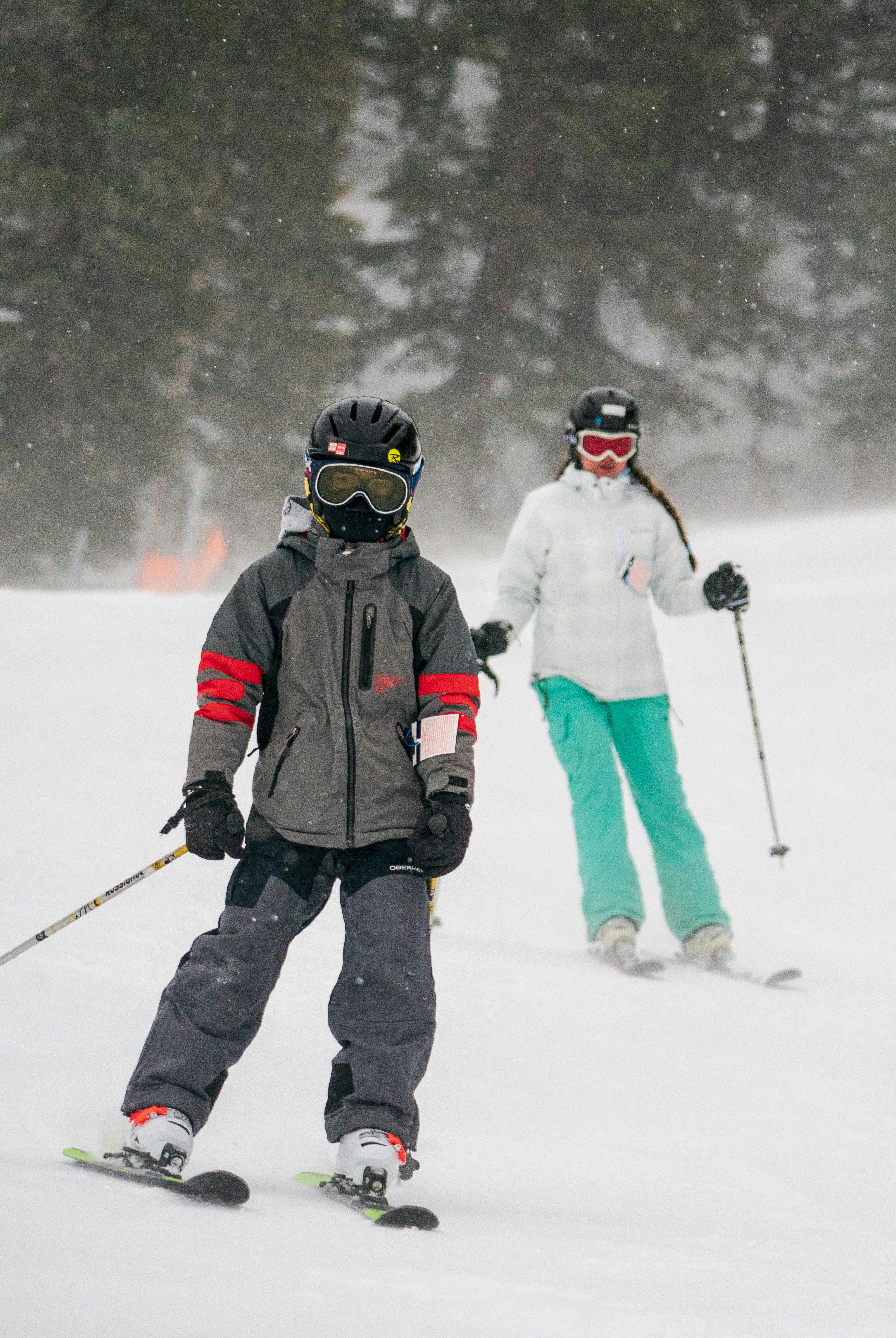 Kids skiing on a powdery day at Taos Ski Valley.